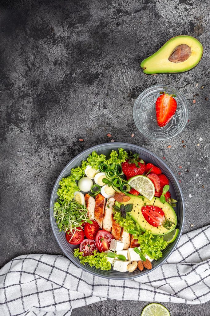 ketogenic diet food chicken fillet quinoa avocado avocado feta cheese quail eggs strawberries nuts lettuce healthy meal concept vertical image top view place text 114941 2993